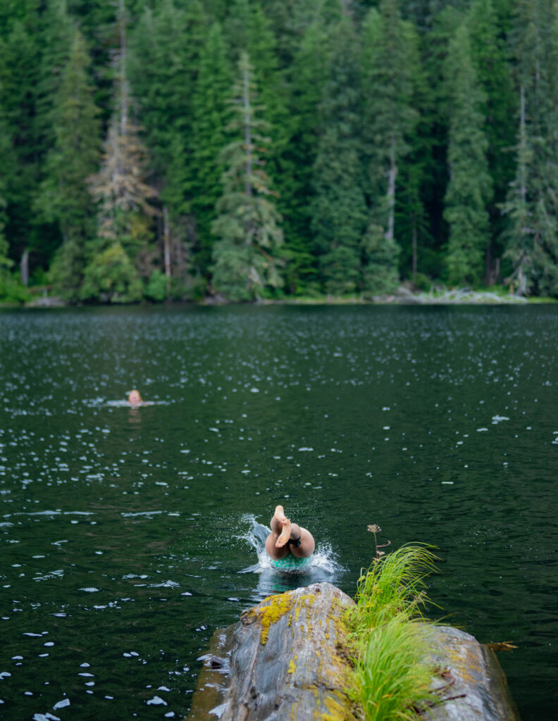 A swimmer diving into salmon lake.