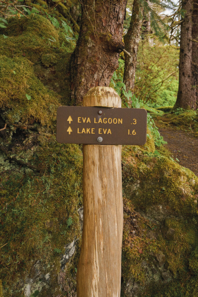 A trailsign on the Lake Eva trail. Signs read, "Eva Lagoon .3" and "Lake Eva 1.6".